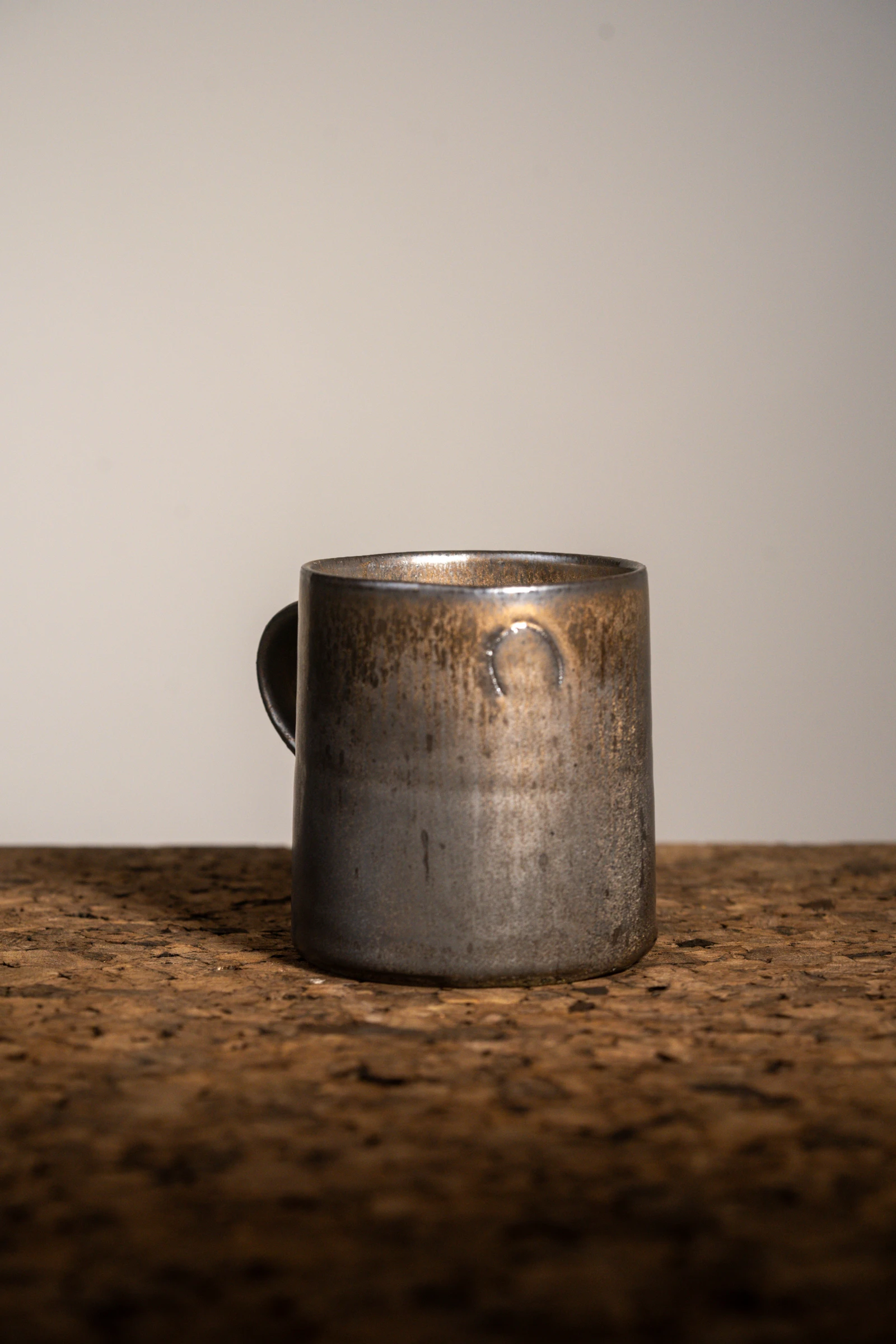 Bronze Mug C10 — stoneware handled mug in bronze glaze, photograph 2 of 5