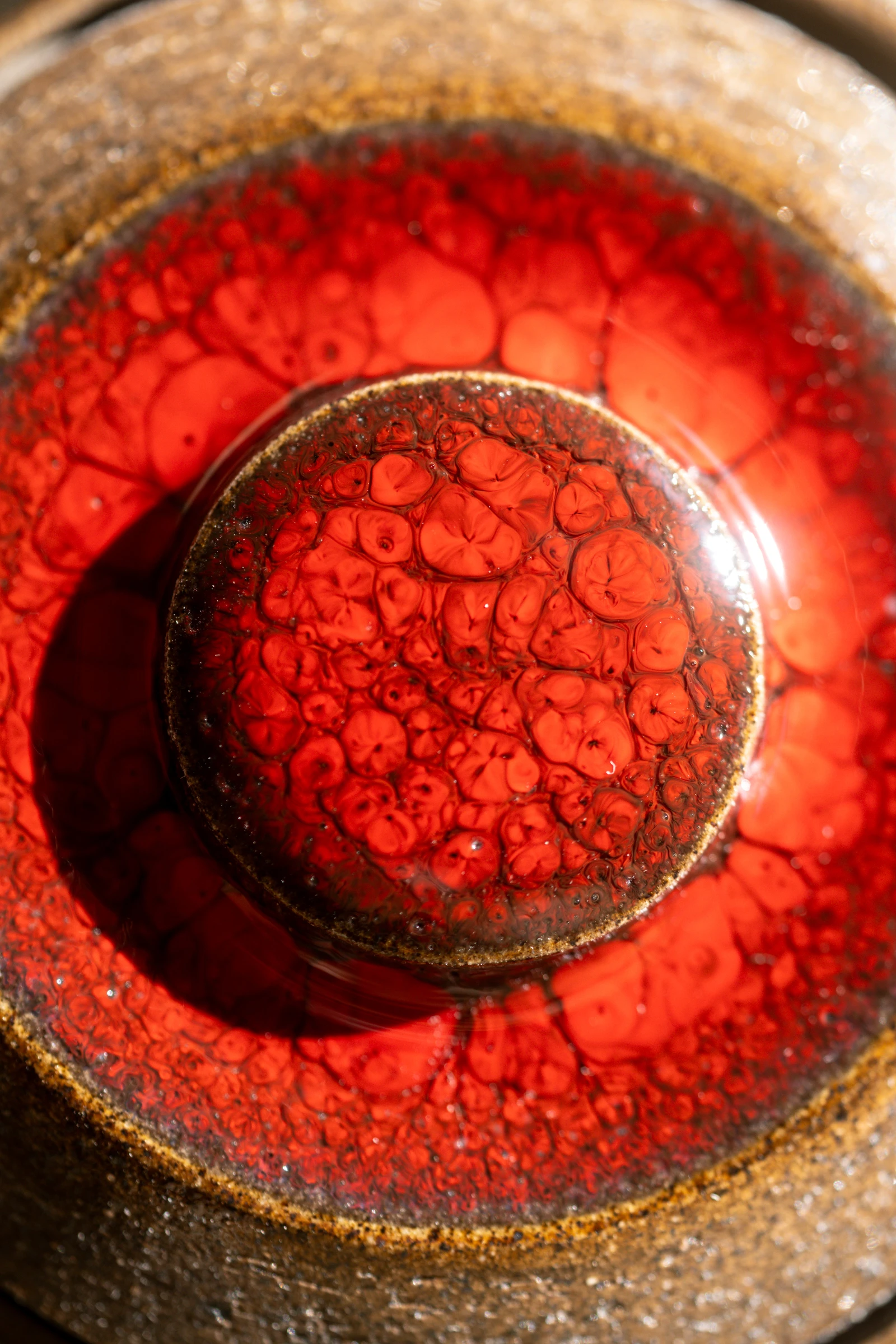 Glaze resting on the surface before firing