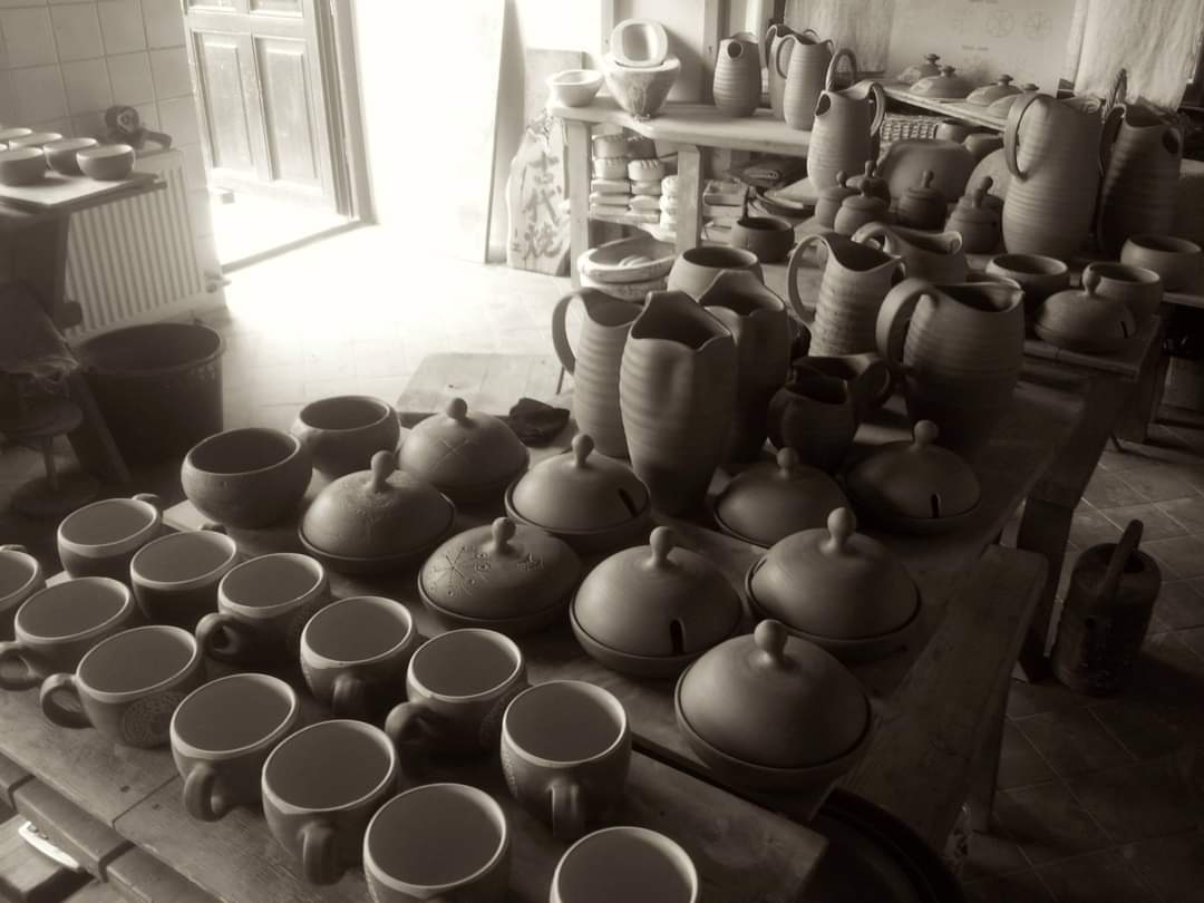 Tenis Preiss studio table with handmade cups, teapots, and vessels