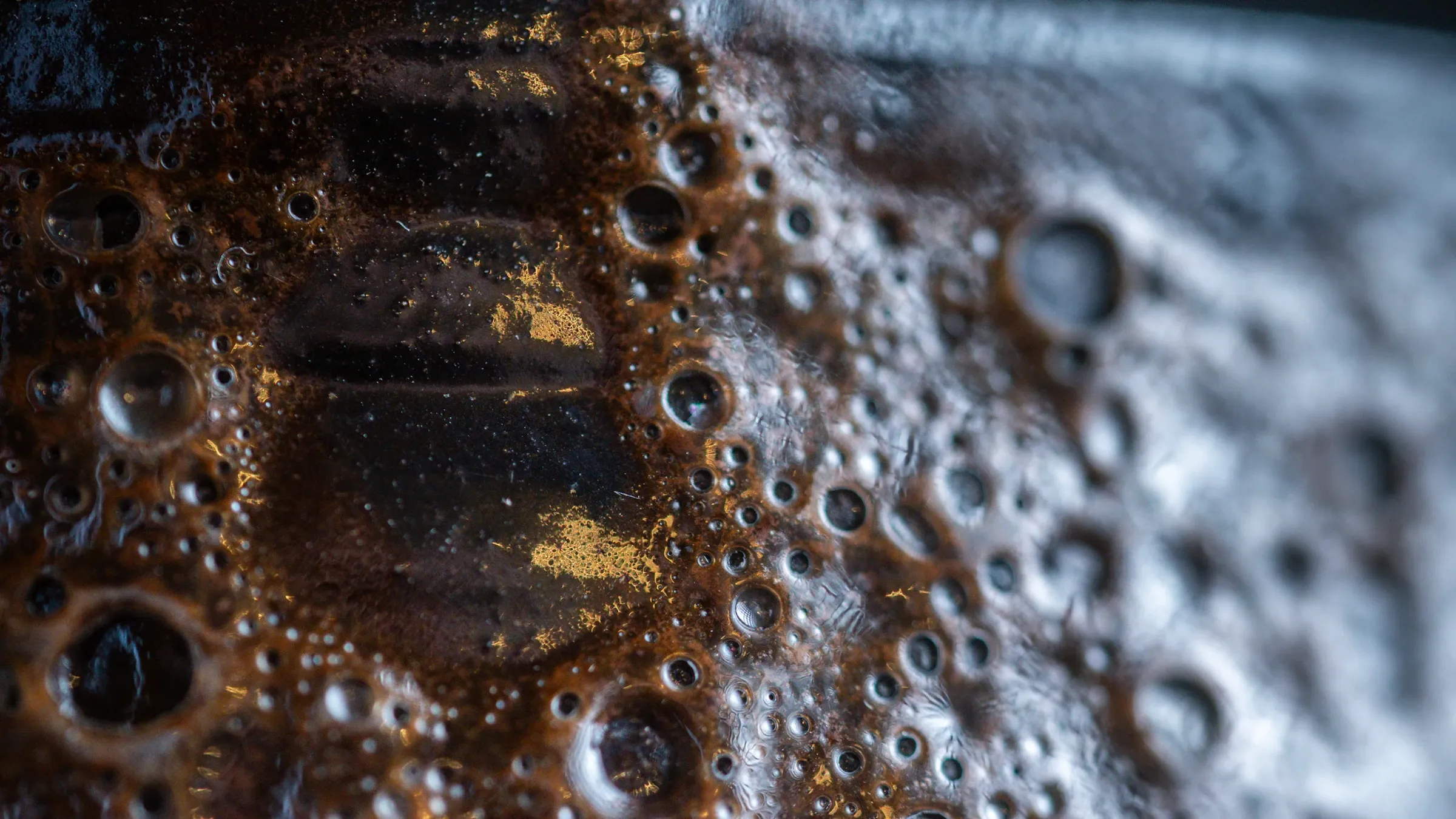 Bronze and gold ceramic glaze texture close up