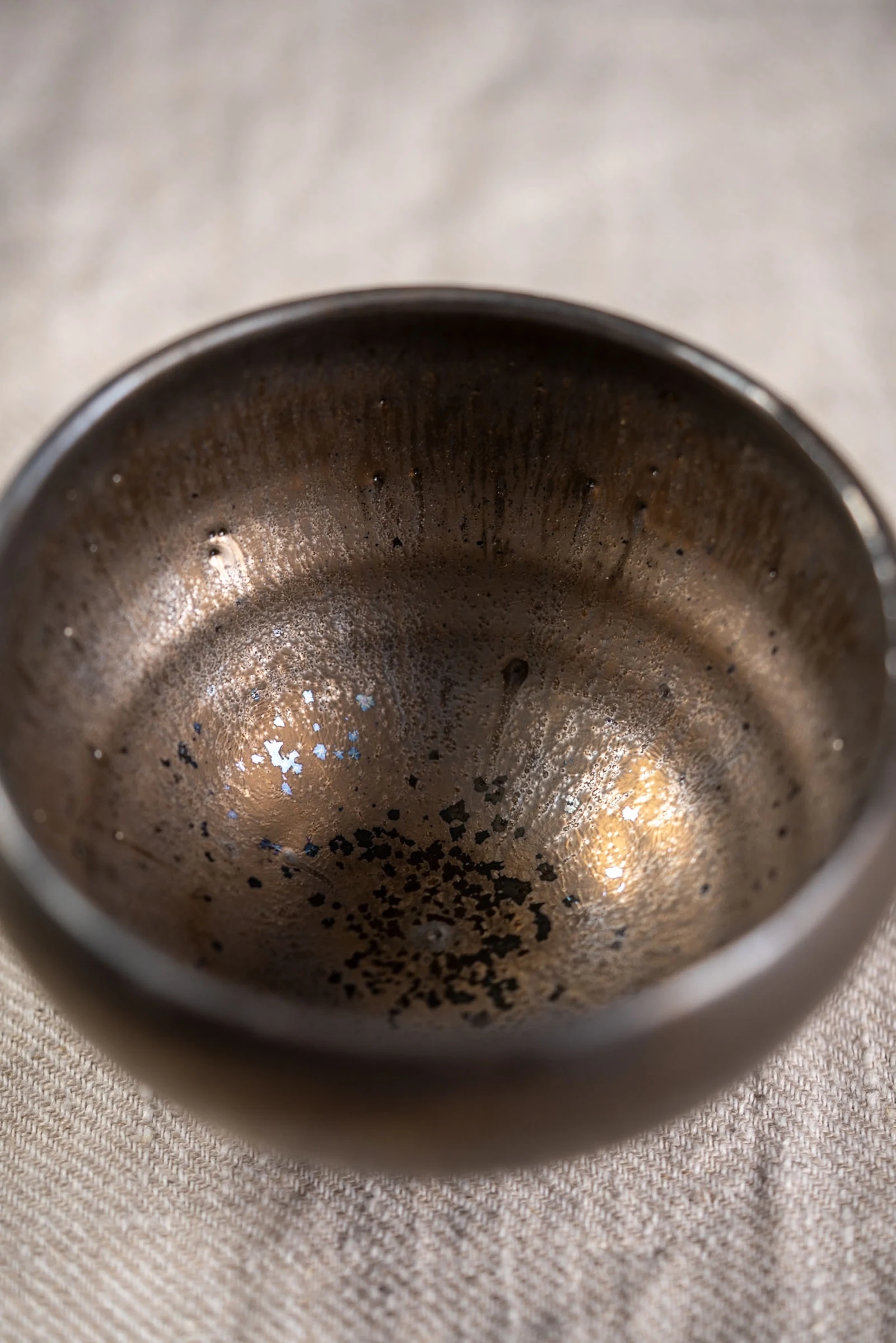 Turquoise handled mug on a quiet surface