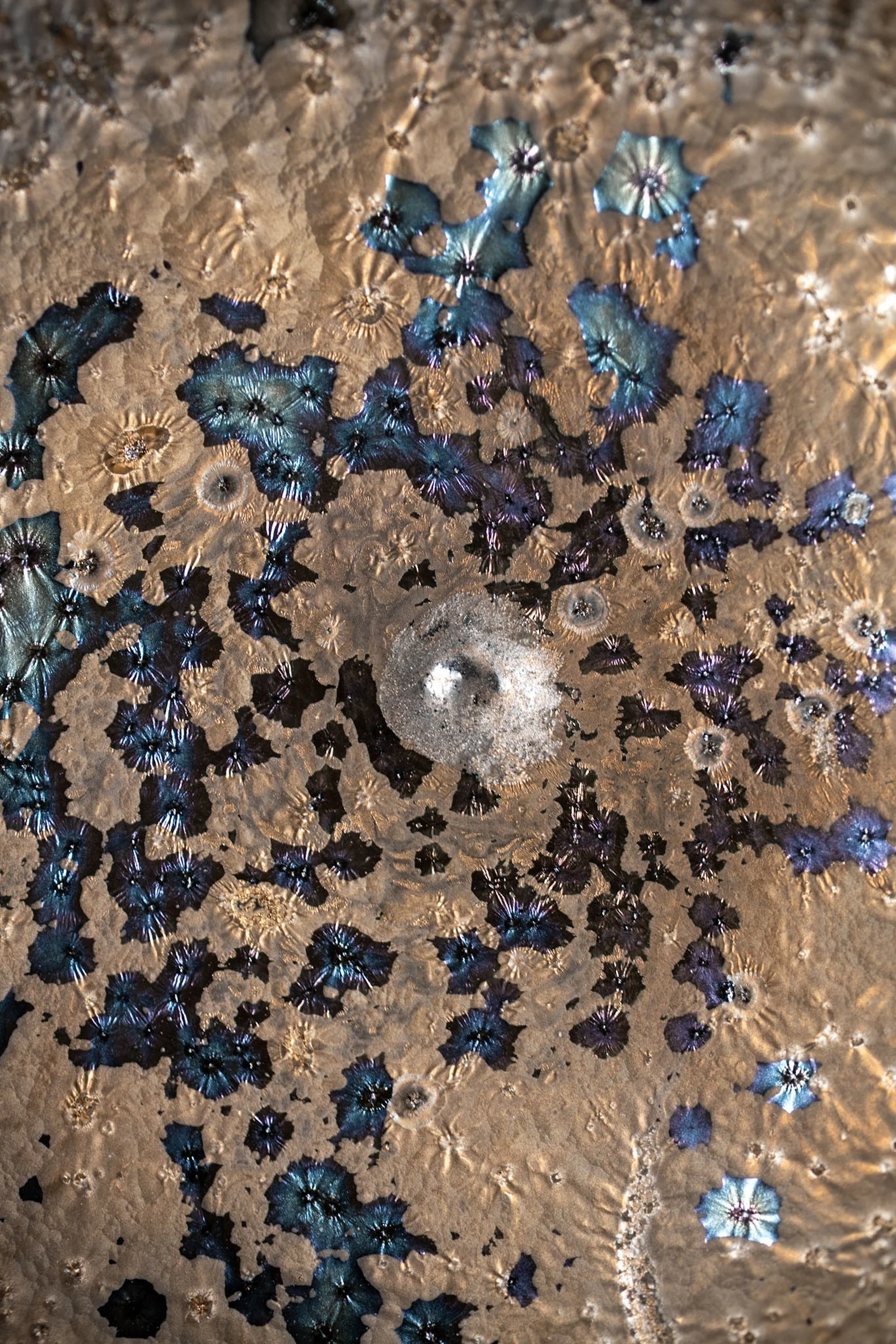 Speckled blue cup photographed on linen